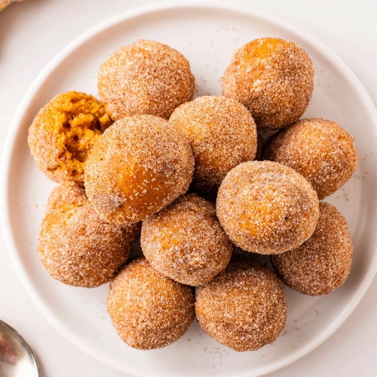 Delicious pumpkin muffin donut holes, ideal for breakfast or a sweet snack treat.