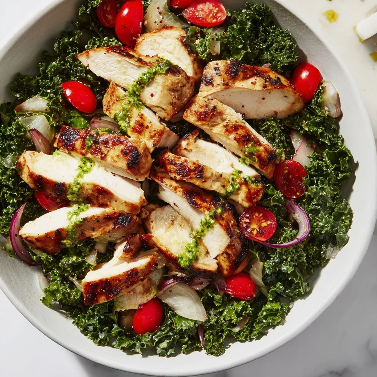 Juicy Chimichurri Grilled Chicken Bowl with Garlic Sauce, topped with roasted vegetables and greens.  