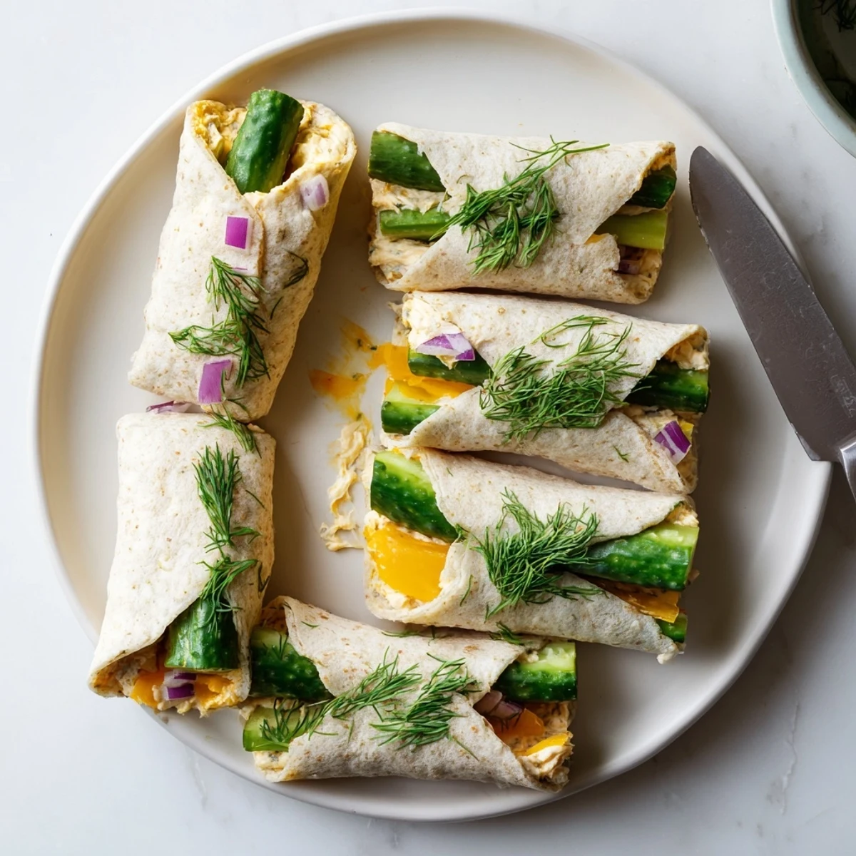 Crispy pickle-in-a-blanket rolls with creamy cheese, ideal for party snacking.  