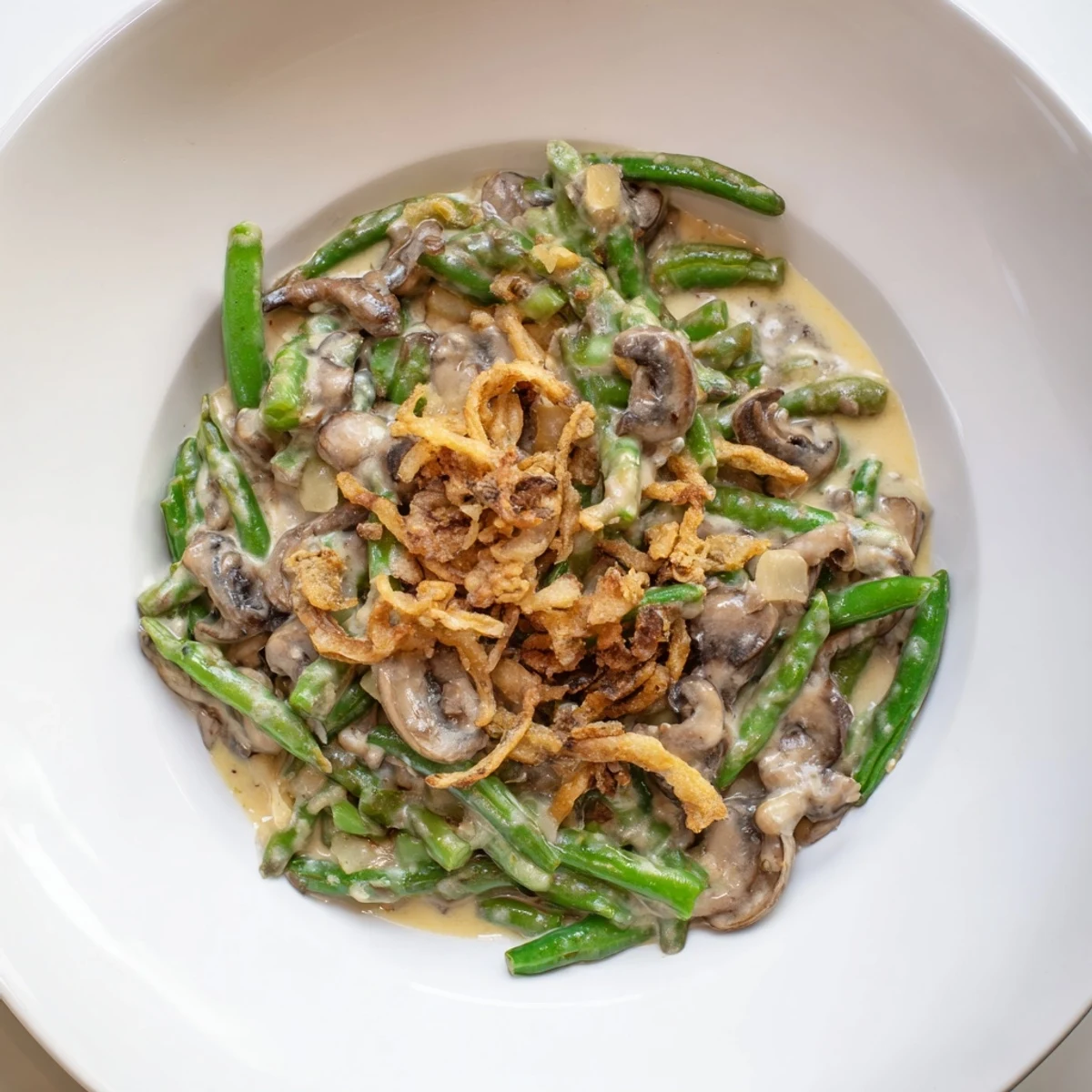 Creamy Old-School Green Bean Casserole with golden crispy onions, a comforting Thanksgiving side.