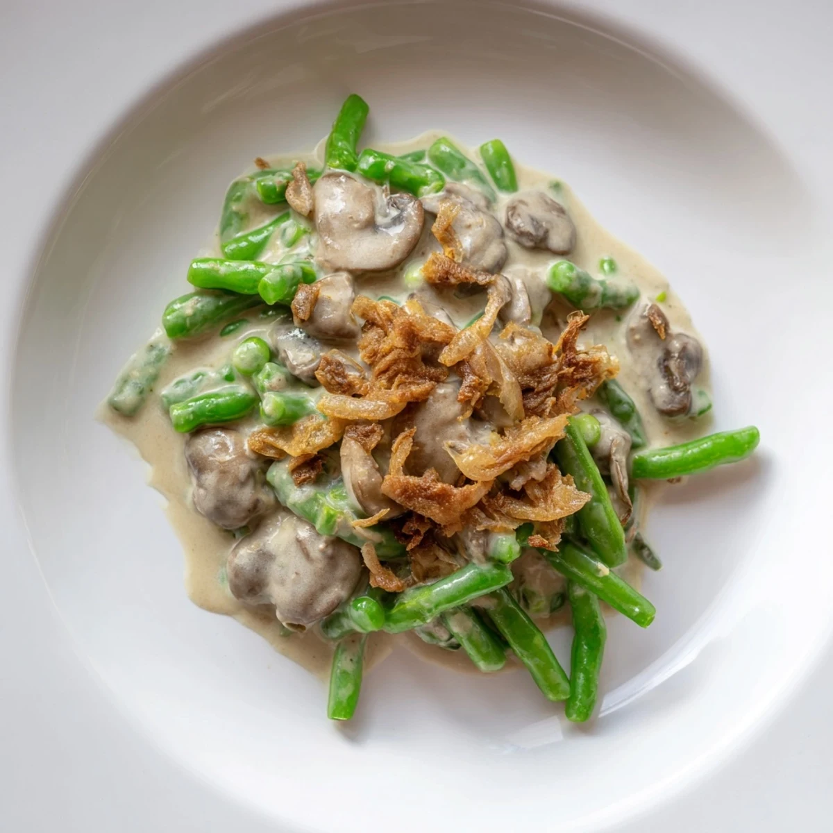 This homemade Old-School Green Bean Casserole features a rich mushroom sauce, perfect comfort food.