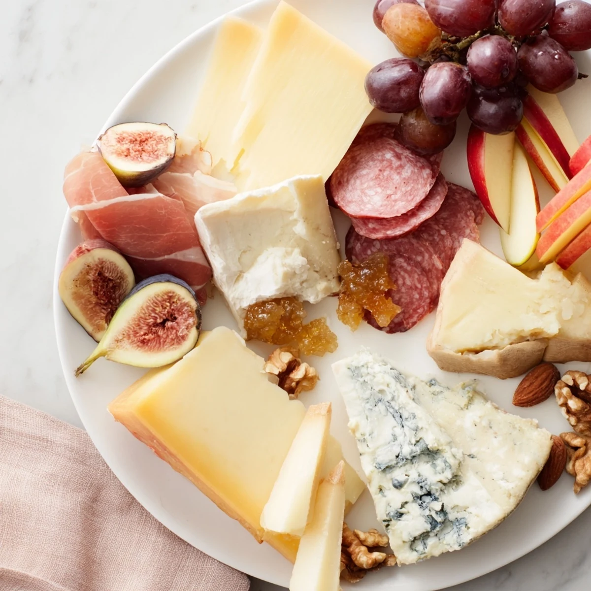 A beautifully arranged wine pairing board with cheeses, meats, fruits, and crackers perfect for entertaining.