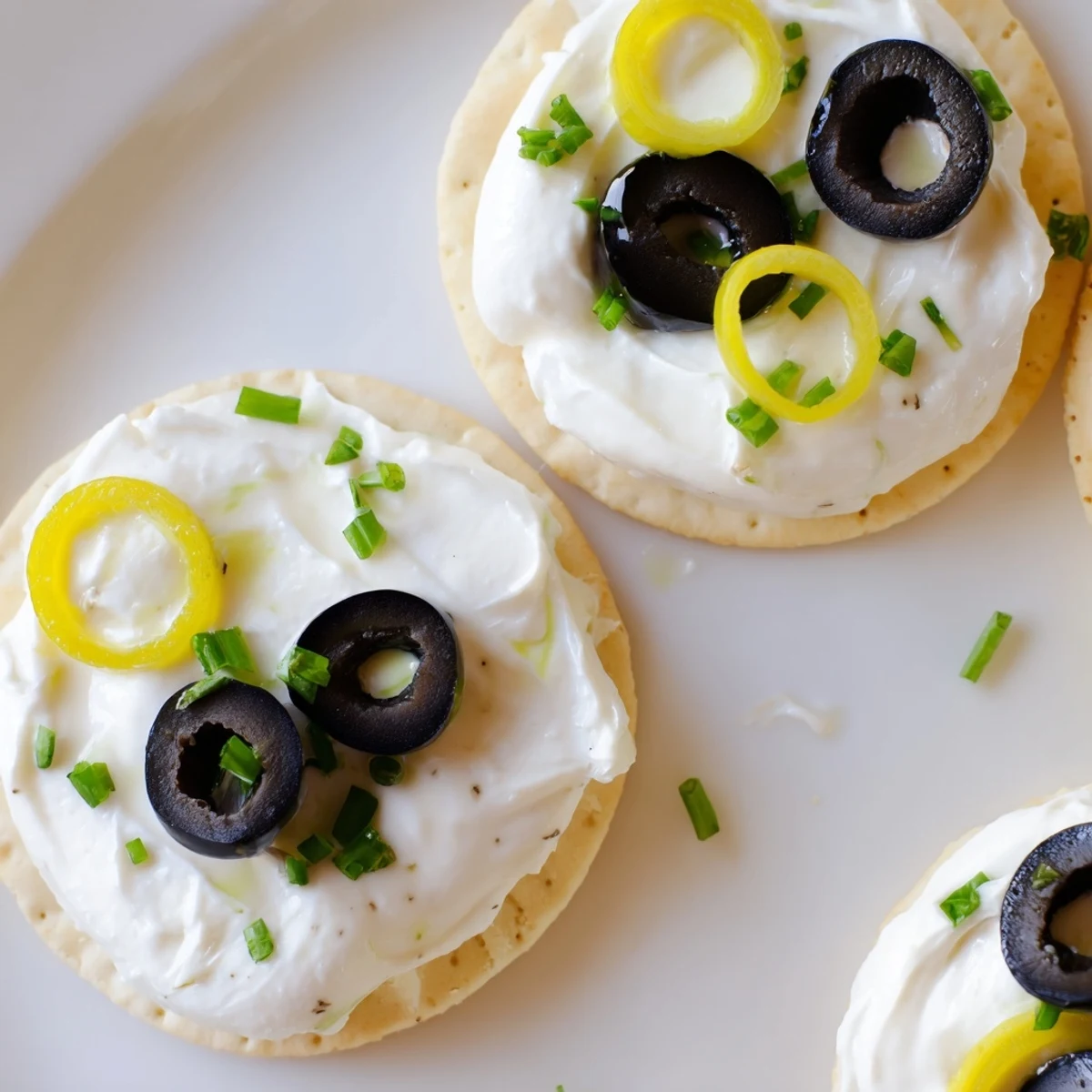 Gold Medal Olympic Ring Appetizers: Vibrant, colorful rings of cream cheese, veggies, and crackers on a platter.