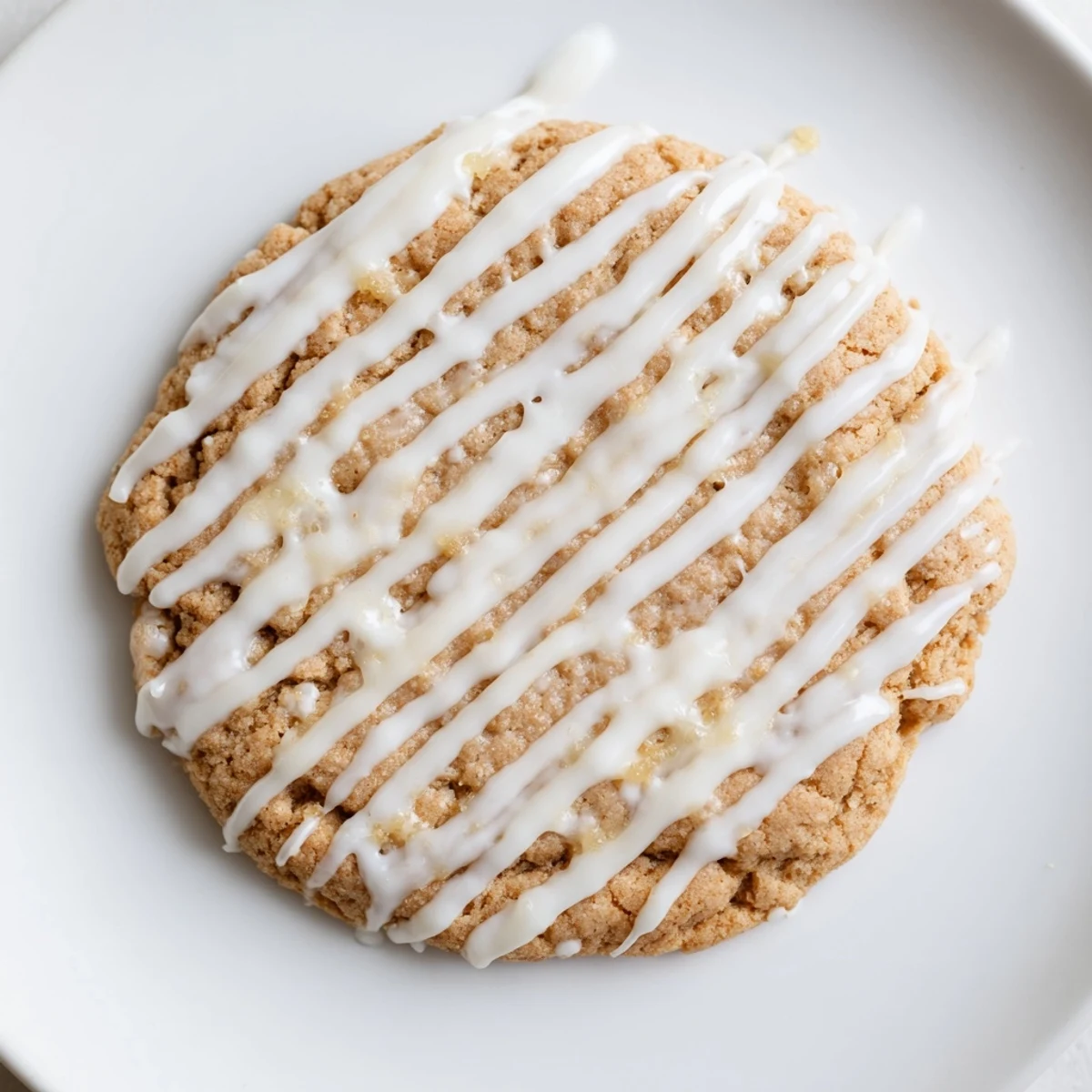 Golden, round Holiday Cookies with Icing Drizzle, drizzled with colorful icing, ready to be enjoyed!