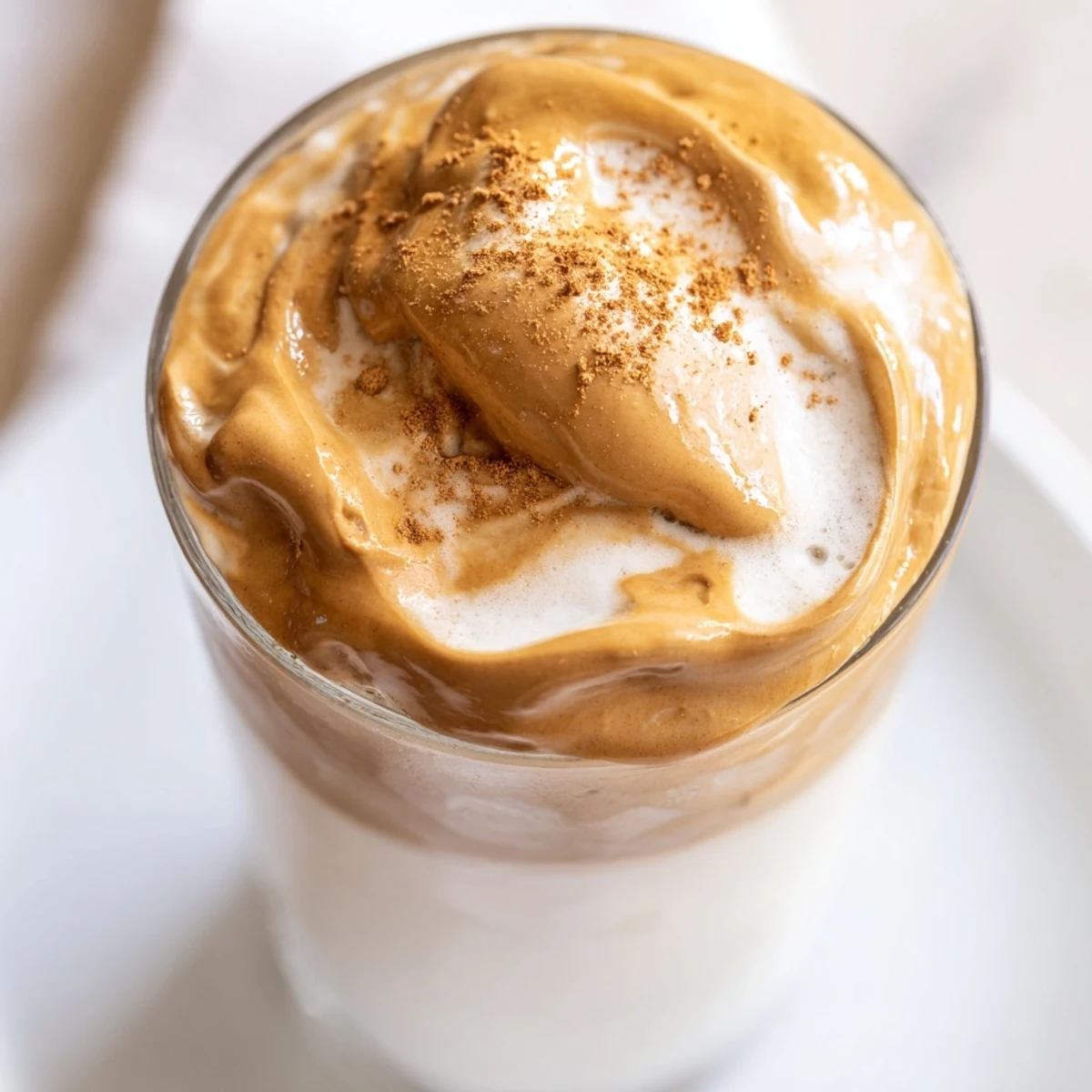 Enjoy a refreshing glass of Brown Sugar Dalgona Latte, with a sweet caramel aroma and creamy texture.