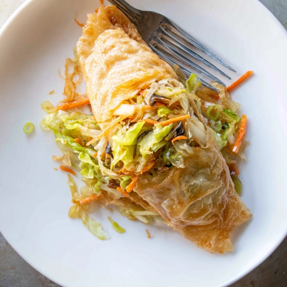 These crispy rice paper dumplings showcase a perfectly fried, textured surface with a flavorful blend.