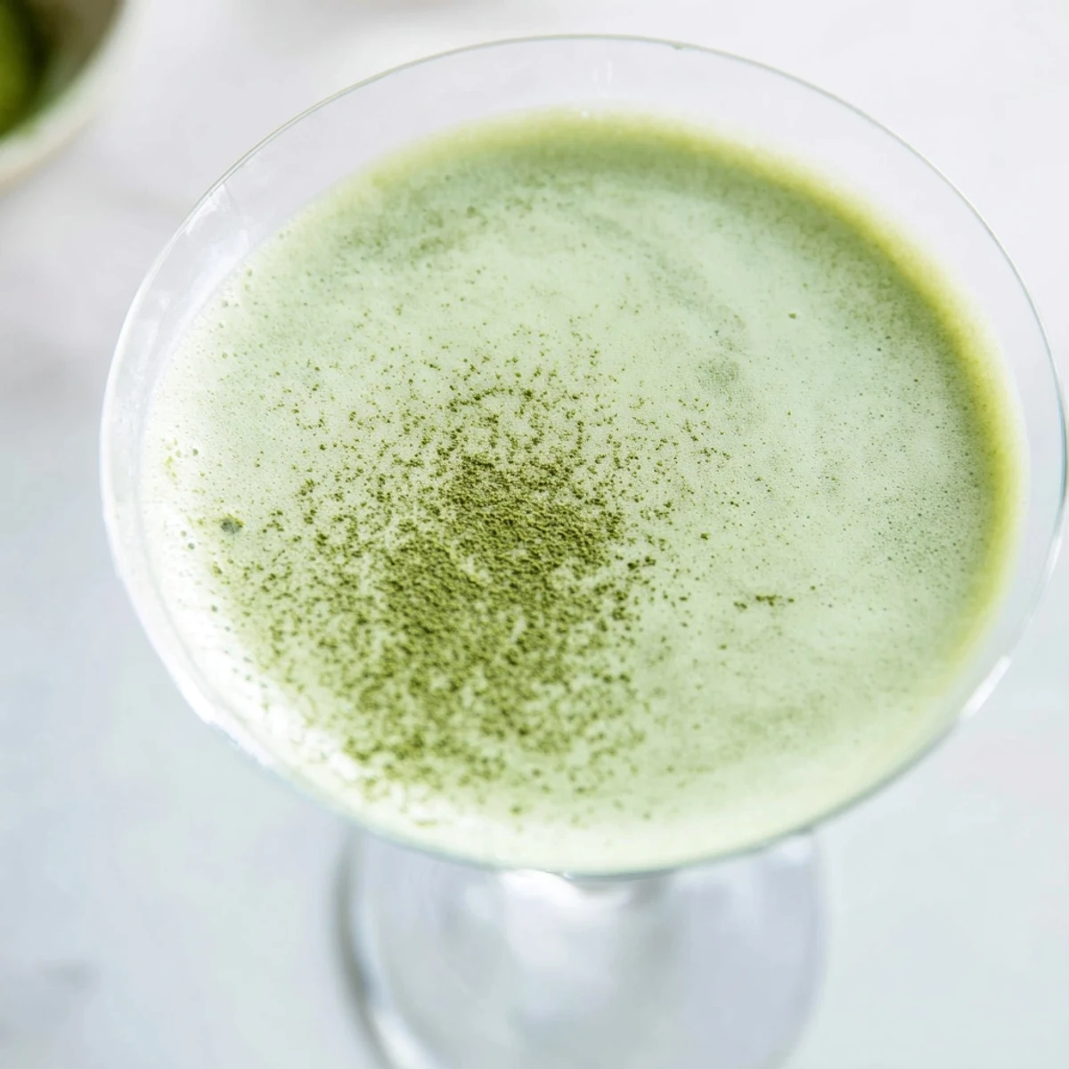 A beautiful close-up of a refreshing Matcha Martini, ready to sip with earthy notes.
