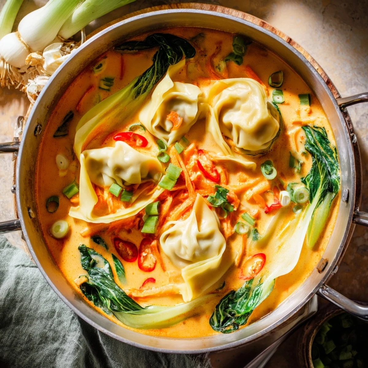 A quick 25-minute Thai-inspired dinner featuring tender wontons and carrots in aromatic broth.