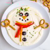 Creamy Melted Snowman Dip Bowl, ready to scoop with crackers, a festive party snack.
