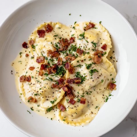 Creamy Olive Garden Ravioli Carbonara with crispy pancetta, perfect for a cozy, Italian dinner.