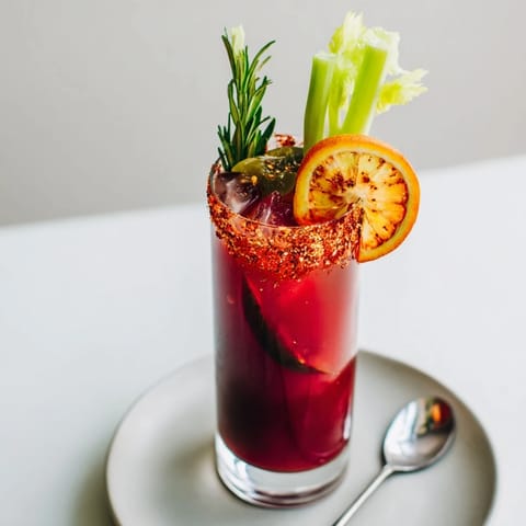 Enjoy the refreshing Spicy Fall Mocktail, bursting with smoky cranberry flavors.  