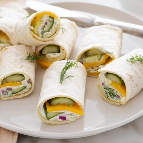 Delicious pickle-in-a-blanket appetizer served with a tangy mustard dipping sauce.  