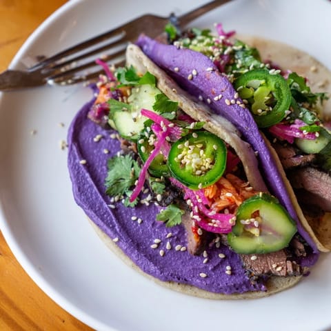 Deliciously marinated beef sirloin in Global Street-Food Fusion Tacos, bursting with flavors.  