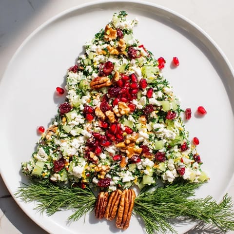 Beautifully arranged Cranberry & Feta Cheese Tree Dip, shaped like a holiday tree, ready for dipping.
