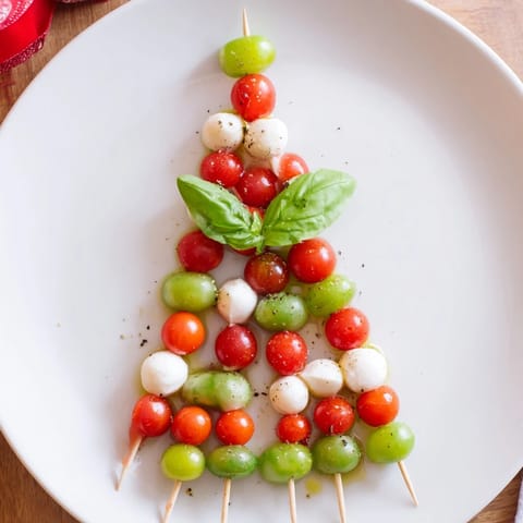 Festive Caprese Skewer Tree with a drizzle of olive oil, ready for a delicious vegetarian holiday appetizer.