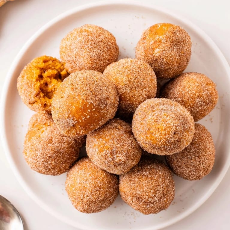 Delicious pumpkin muffin donut holes, ideal for breakfast or a sweet snack treat.