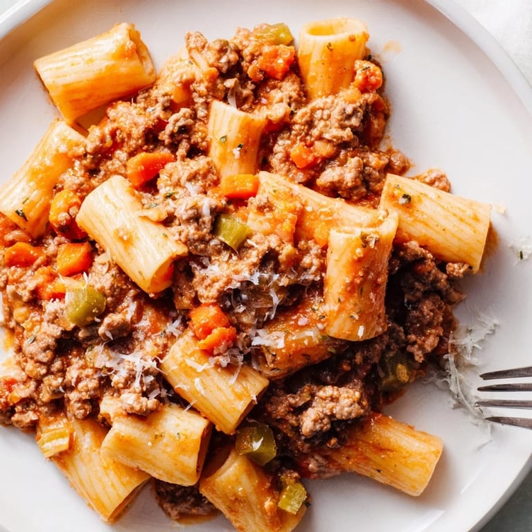 Hearty Homemade Bolognese Sauce featuring ground beef, vegetables, and creamy tomato goodness.