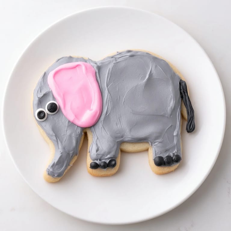 Freshly baked Biscuits Amical Éléphant Géant adorned with gray icing are perfect for a kids party.