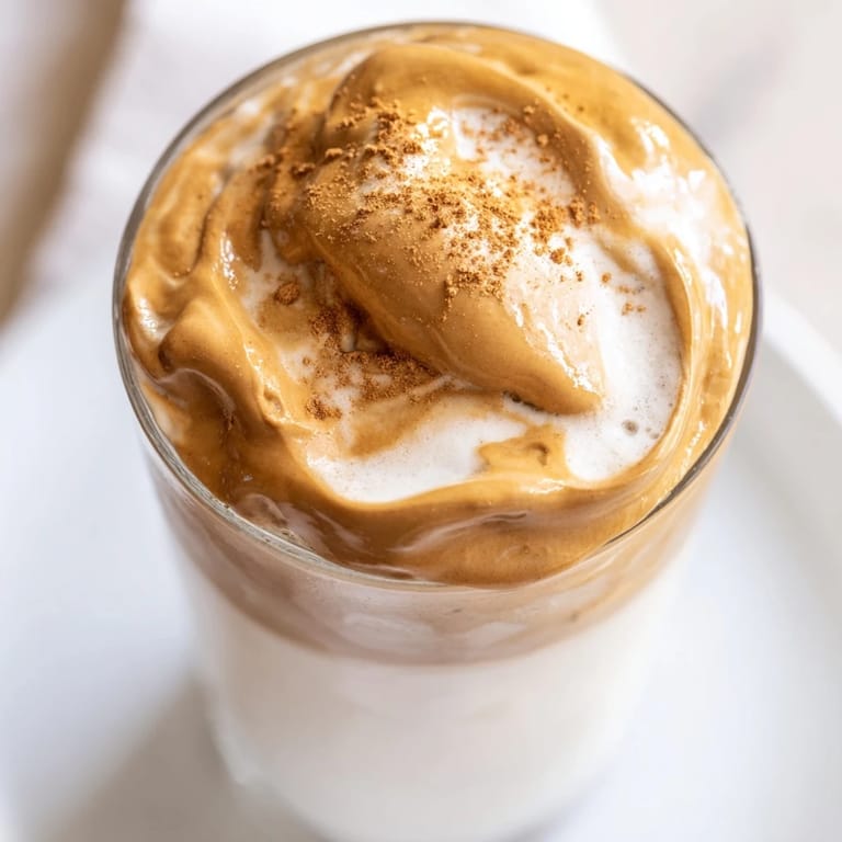 Enjoy a refreshing glass of Brown Sugar Dalgona Latte, with a sweet caramel aroma and creamy texture.